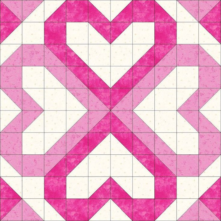 a pink and white quilt with an arrow pattern on it's center piece, in the shape of a heart