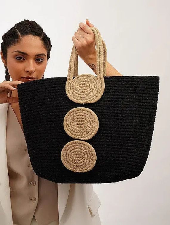 Handmade Jute tote bag designed for everyday use. This shoulder bag is perfect to keep all your essentials close. The design is stylish that will complement any casual or formal outfit even.  It can complete any casual outfit and make you feel comforable on a long demanding day. This is one of a kind handcrafted bag which is handcrafted to order. As it is a handcrafted product, it may have slight irregularities or imperfections.  Material: Jute Measurements Length - 35.56cm Width - 48.26cm Handle - 12.70cm Trendy Jute Bucket Shoulder Bag, Trendy Bucket Jute Shoulder Bag, Casual Canvas Shopping Bag With Handles, Trendy Large Capacity Jute Bag, Trendy Jute Shoulder Bag For Shopping, Casual Jute Bag With Large Capacity, Modern Crochet Tote Bag For Shopping, Casual Jute Bucket Bag For Daily Use, Trendy Jute Bag With Adjustable Strap