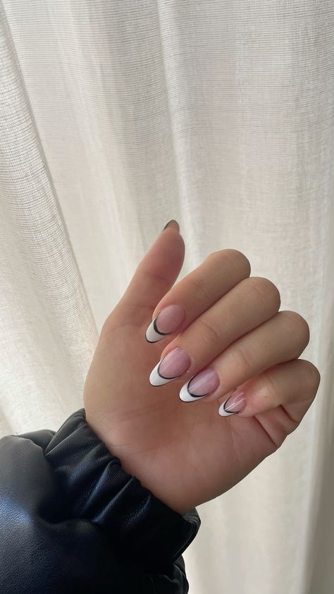 French Tip With Feature Nail, White Tips With Black Design Nails, White Nails With Black Outline, White French Tip With Black Outline, Black And White Almond Nails Simple, White Tip With Black Line, White French Tip With Line Under, White French Tip Nails With Black Line, French Manicure With Black Line