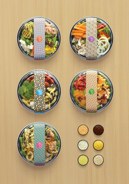 four plates with different types of food in them on top of a wooden table next to sauces and condiments