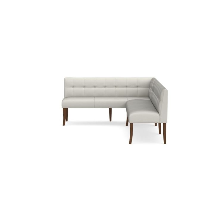 a white couch and ottoman sitting next to each other on a white background with no one in it