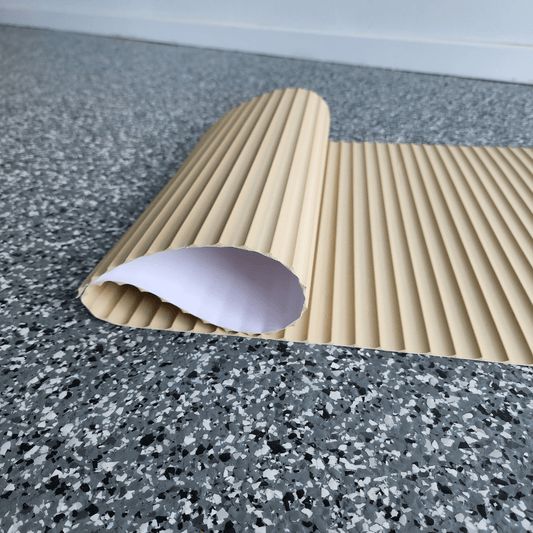 a close up of a mat on the floor with a paper roll sticking out of it