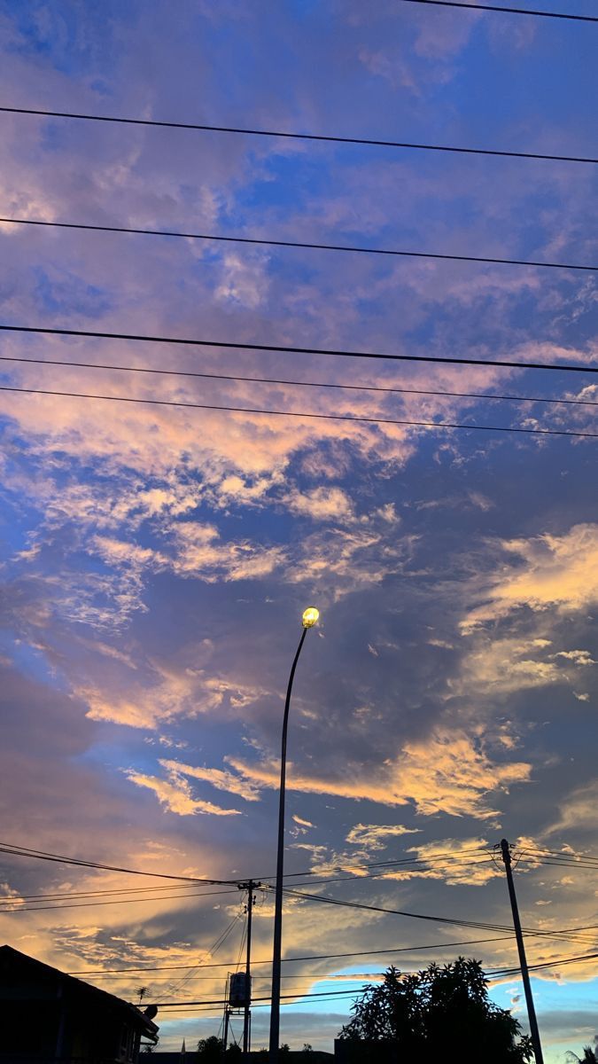 the sky is blue and pink with some clouds