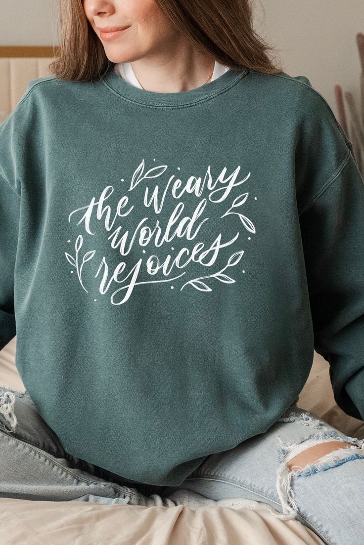 Original SGC design, “The Weary World Rejoices” on the perfect warm and cozy Comfort Colors crewneck. In a world marked by weariness, sin, and longing, the phrase “The Weary World Rejoices” is a profound proclamation of the hope brought by Christ’s coming. Reflecting on Isaiah 9:2, “The people who walked in darkness have seen a great light,” we are reminded that Jesus is the light who pierces through the deepest sorrow. John Calvin writes of this hope, “When the Prophet speaks of light, he direc The Weary World Rejoices, Weary World Rejoices, Jesus Is The Light, Weary Heart, Dreamy Wardrobe, Luke 2 10, Shirts Diy, Isaiah 9, John Calvin