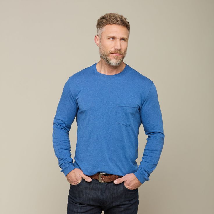 This Long Sleeve Bar Stitch Tee can be dressed up or casually worn. Tucked or untucked, this is a breathable long sleeve silhouette with a tonal chest pocket. Embellished with intricate bar stitching along the chest pocket and shirttail, this detail adds subtle visual texture to a contemporary piece. Side vents allow comfort and breathability. A mirrored-L embellishment on the lower left-hand side of the front gives a subtle Lucchese signature. Model is 6'1 and wearing size M. Relaxed Fit Long Sleeve Tops With Patch Pockets, Solid Color Long Sleeve Tops With Patch Pockets, Solid Long Sleeve Tops With Patch Pockets, Blue Tops With Patch Pockets For Everyday, Blue Long Sleeve Tops With Pockets, Everyday Blue Tops With Welt Pockets, Casual Blue Tops With Welt Pockets, Blue Tops With Patch Pockets For Fall, Blue Long Sleeve Tops With Welt Pockets