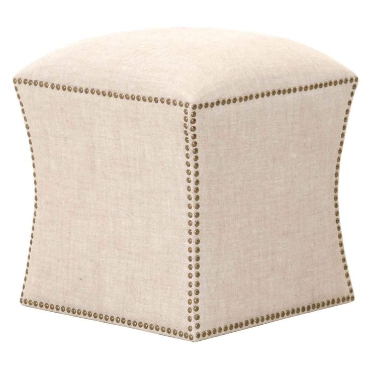 a white ottoman with studded trim on the top and bottom, sitting against a white background