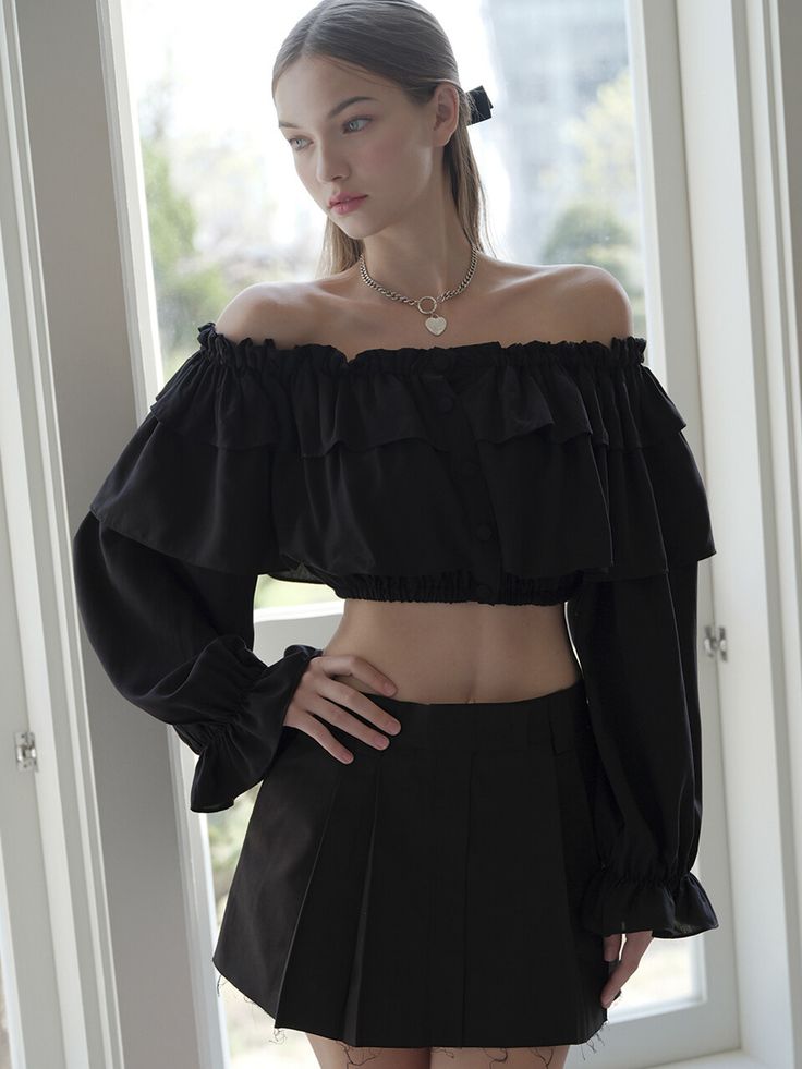 Editor's NotesProvence crop blouse BLACK from AVANDRESS is a blouse with off-the-shoulder style ruffle details. It has button details, the buttons are the same color as the fabric.- Cropped length- Off-the-shoulder- Ruffle details- High quality stitchesMeasurements (in.)- FREE- Length: 8.4 in.- Shoulder: 12.5 in.- Chest: 14.5 in.- Sleeve: 22.4 in.*Model InformationModel 1- Height: 5'6 Top: S Bottom: MModel 2- Height: 5'6 Top: S Bottom: MComposition & Care- 57% Cotton, 38% Polyester, 5% Spandex- Dry Clean OnlyDesigner- by AVANDRESS Chic Cropped Ruffle Crop Top, Elegant Off-shoulder Crop Top With Ruffles, Chic Off-shoulder Crop Top For Date Night, Elegant Cropped Blouse With Ruffles, Elegant Cropped Ruffle Blouse, Black Ruffled Crop Top, Black Cropped Ruffle Crop Top, Black Off-shoulder Blouse With Ruffles, Black Chic Cropped Off-shoulder Top