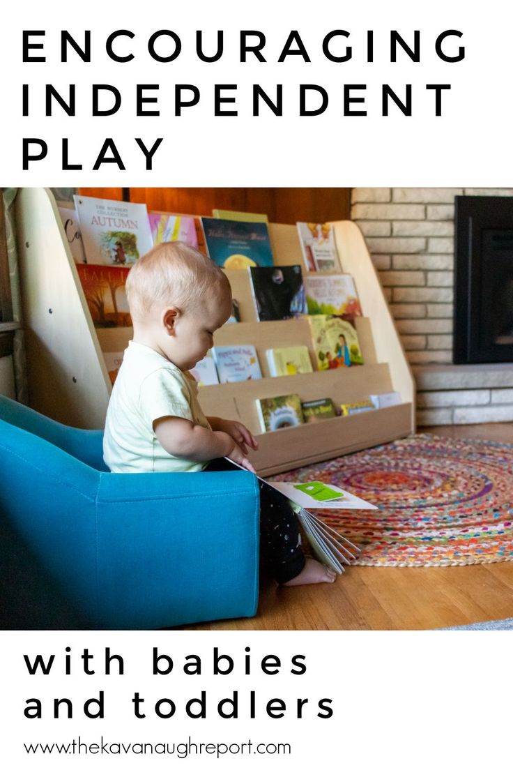 a baby sitting on a blue chair reading a book with the title, encouraging independent play with babies and toddlers