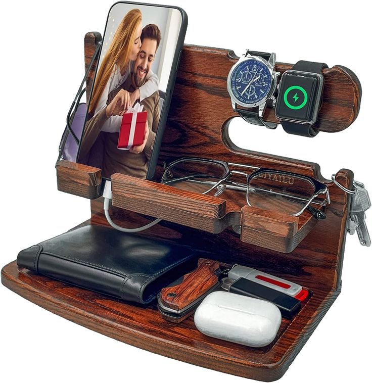 an image of a man holding a woman's face in a wooden case