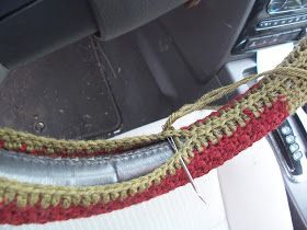 the interior of a car with a steering wheel cover and some wires attached to it