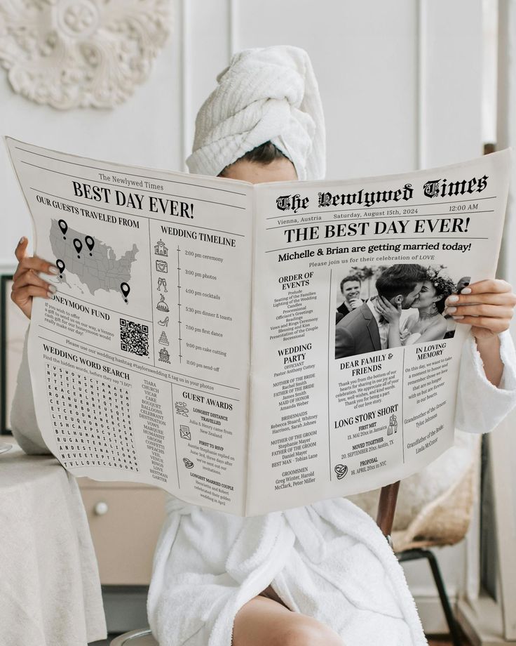 a woman sitting in a chair while reading a newspaper with her head wrapped around her