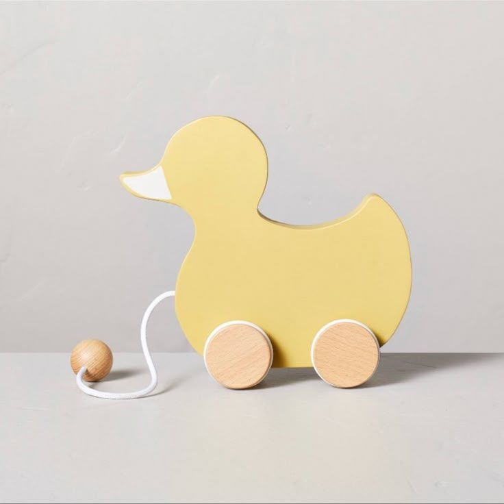 Pull-Along Painted Wooden Duck Toy Features Duck-Shaped Wood Cutout On Wooden Wheels Fabric And Wood Ball Handle For Pulling Along Floor Great Gift With A Charming Antique Look Suitable For Ages 18 Months And Up For A Cute And Classic Child's Toy, This Pull-Along Duck Toy From Hearth & Hand With Magnolia Makes A Perfect Pick. The Design Features A Duck-Shaped Wood Cutout Complete With Light Yellow Color And A Contrasting White Beak, And It's Perched On Natural-Finish Wooden Wheels That Spin And Move The Duck When The Attached Handle Is Pulled. A Wooden Knob On The White Fabric Cord Makes The Pull Handle Easy For Even Little Hands To Grip. Duck Themed Nursery, Ducky Nursery, Kids Holiday Decor, Duck Nursery, Letter Candles, Hearth And Hand With Magnolia, Wood Baby Toys, Magnolia Colors, Baby Shower Announcement