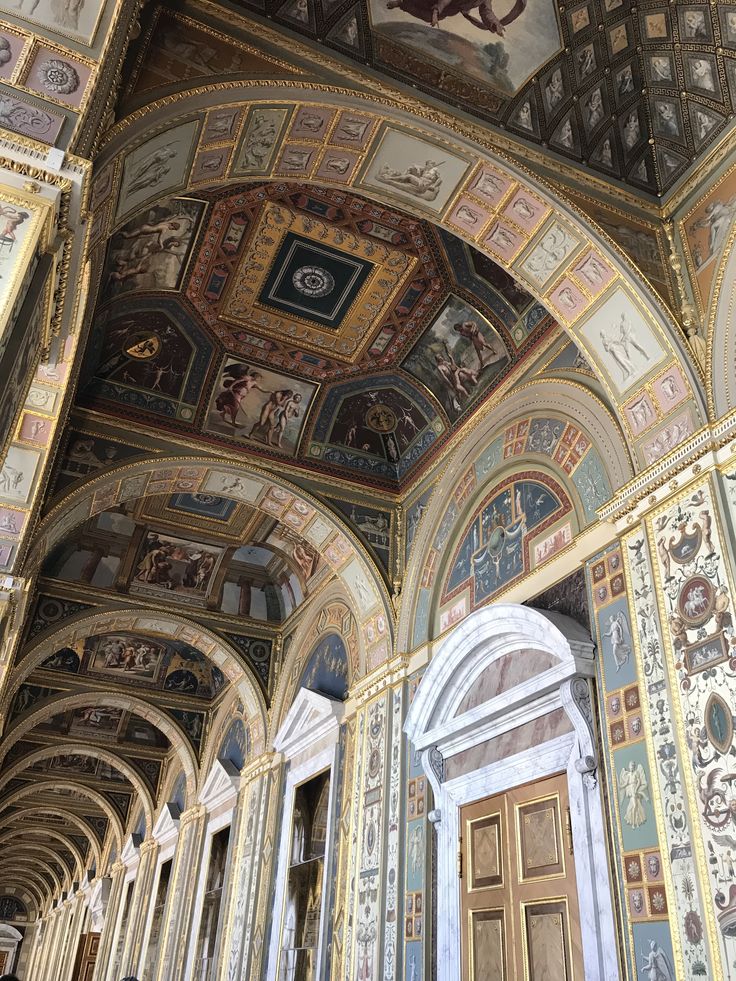 an ornate ceiling with paintings on it