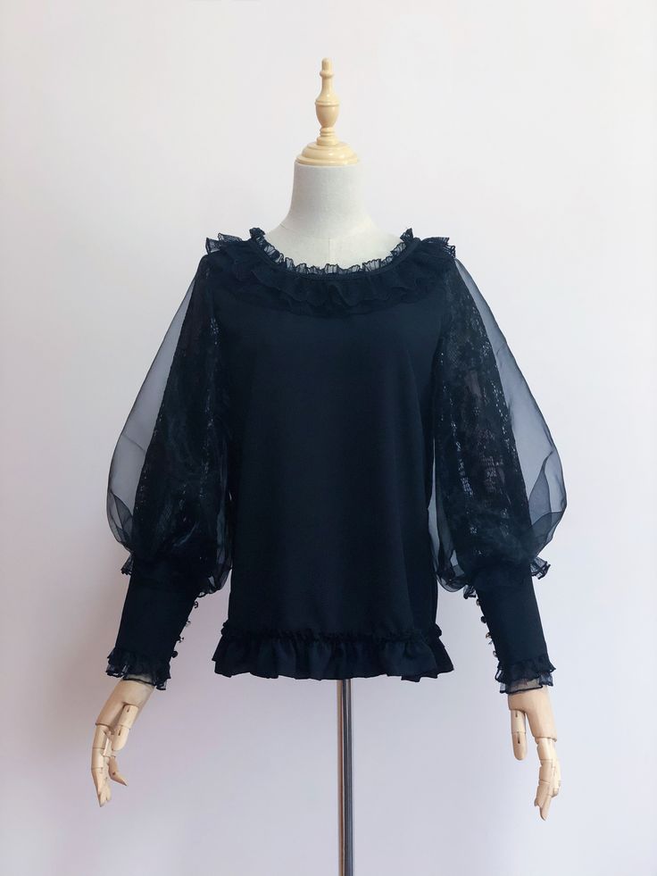 Features: It features ruffled round neckline, leg-of-mutton sleeves, ruffled hem.  Attention: This price includes a blouse only, others are not included.  Size Chart:  Size (CM): Unit CM; Sizes below are measured in flat-laid position, hand measurement will have discrepancy of about 2 CM.   	 		 			Size(cm) 			S 			M 		 		 			Shoulders 			35-38 			39-42 		 		 			Bust 			95 			105 		 		 			Cuffs 			23 			25 Black Puff Sleeve Blouse With Ruffles, Party Blouse With Sheer Sleeves And Crew Neck, Black Tops With Ruffles And Lantern Sleeves, Black Top With Ruffles And Lantern Sleeves, Party Tops With Ruffles And Bell Sleeves, Fall Lace Sleeve Puff Blouse, Fitted Blouse With Lace Trim And Ruffle Sleeves, Fall Blouse With Lace Puff Sleeves, Fall Puff Sleeve Blouse With Lace Sleeves