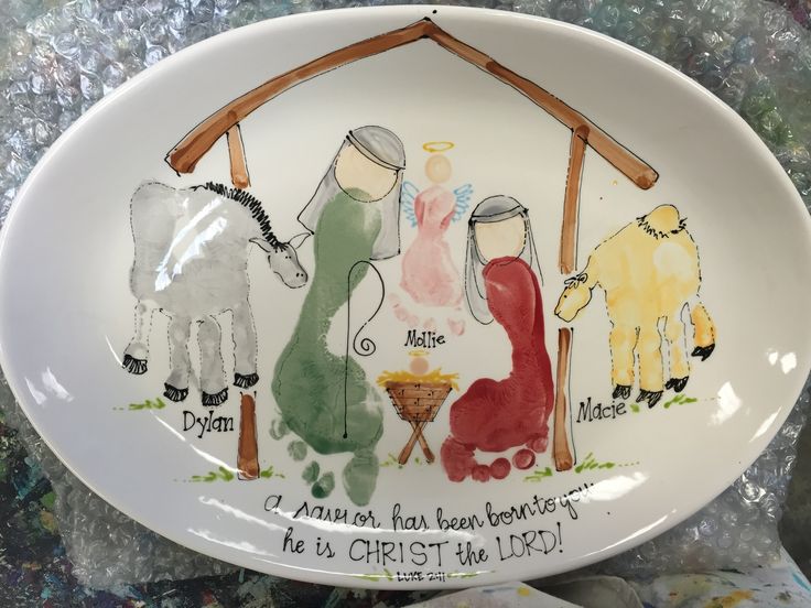 a ceramic plate with the birth of jesus