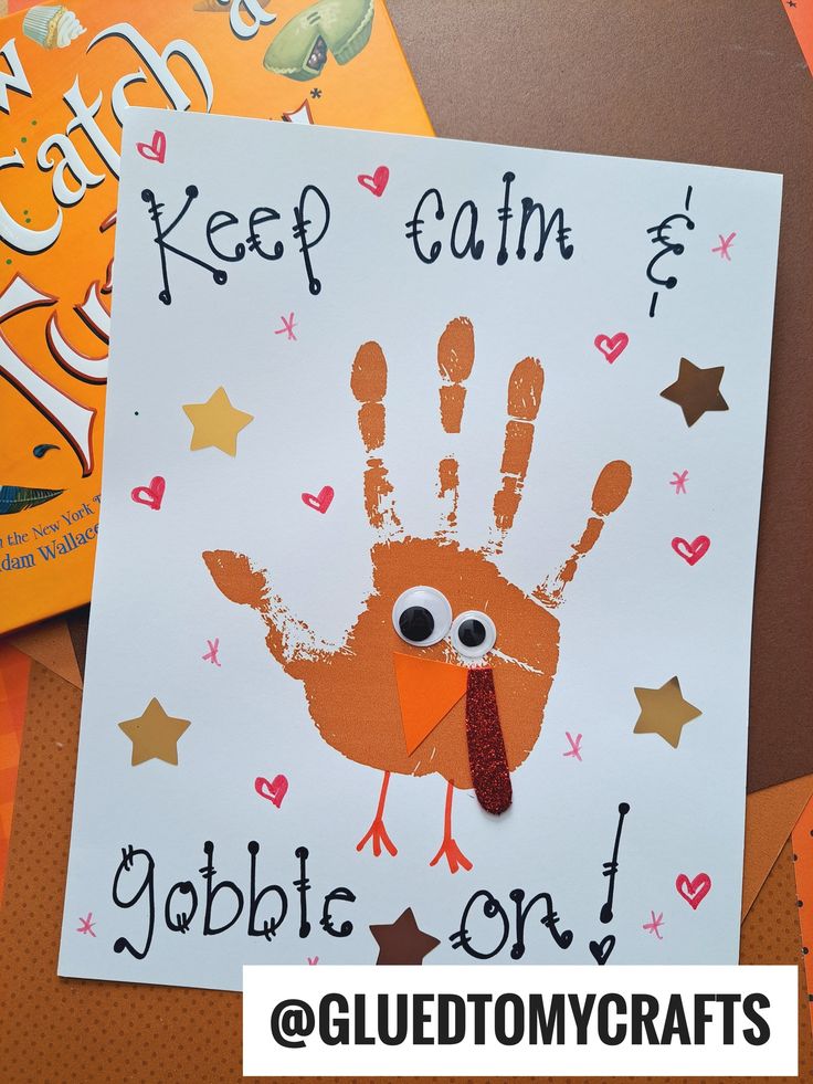 a handprint turkey is on top of a card