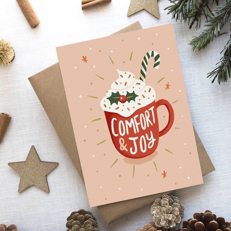 a christmas card with a cup of hot chocolate