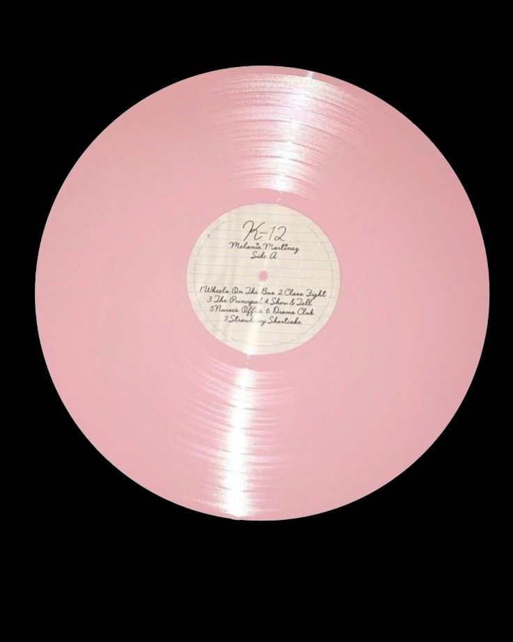 a pink record with writing on it