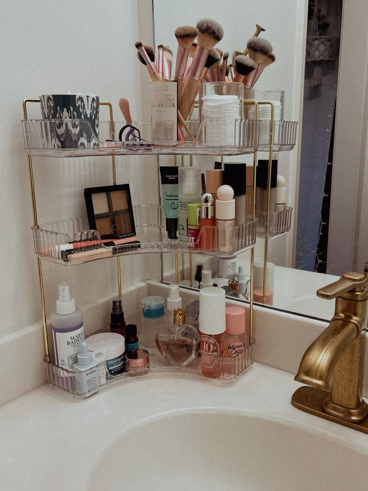 the bathroom sink is filled with cosmetics and personal care items