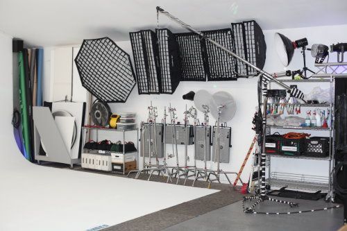 a room filled with lots of different types of equipment and lighting fixtures on the wall