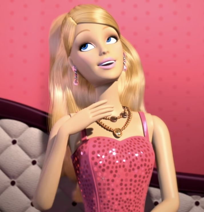 a barbie doll with blonde hair wearing a pink dress and gold jewelry on her neck