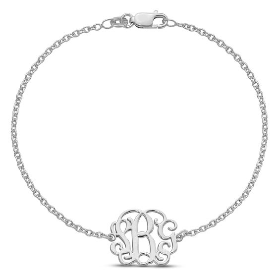 A cherished piece of personalized jewelry with this monogram bracelet. Designed in rhodium plated sterling silver, this signature bracelet holds a charm that may be scripted with your choice of maximum 3 initials in QGVineNew font. This 8.5-inch long and bracelet secures with easy to use lobster clasp. Classic Name Bracelet With Initials For Anniversary, Personalized White Gold Charm Bracelet, Classic Hypoallergenic Bracelets As Personalized Gift, Classic Hypoallergenic Bracelets For Personalized Gifts, Classic Personalized Name Bracelet, Elegant White Gold Name Bracelet As Personalized Gift, Classic Silver Bracelet With Name, Classic White Gold Name Bracelets, Classic Personalized Sterling Silver Bracelet