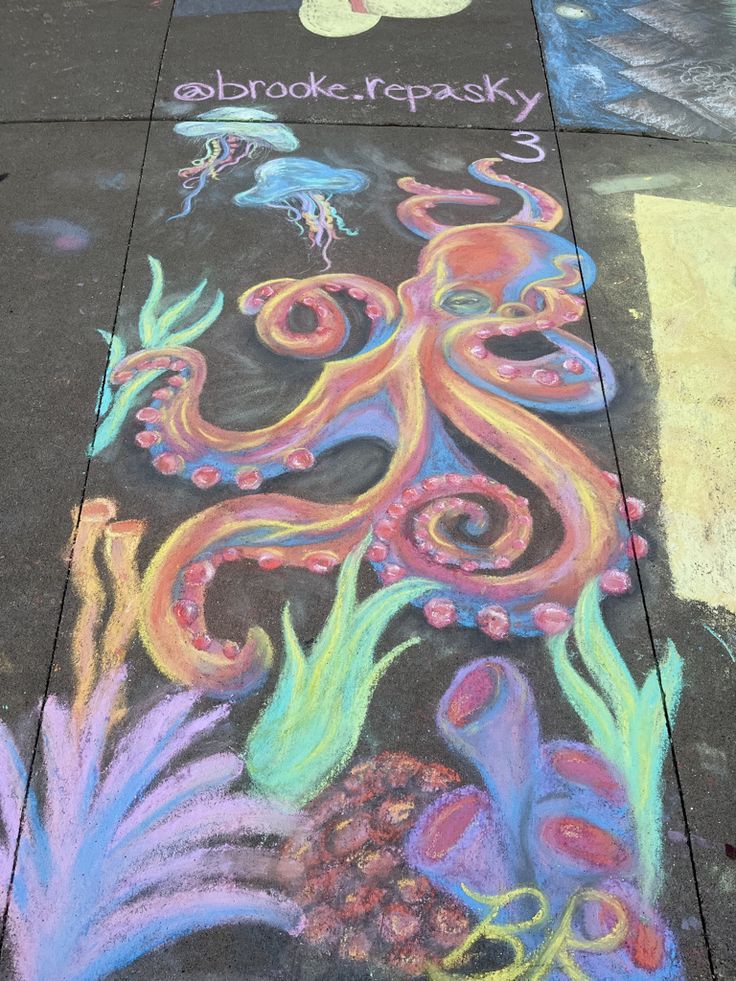 sidewalk chalk art with an octopus and fish on it