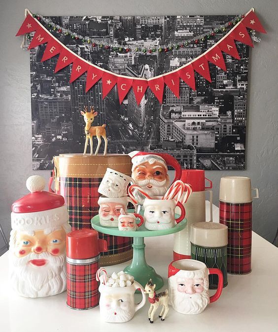 a table topped with santa clause figurines and other christmas decorations