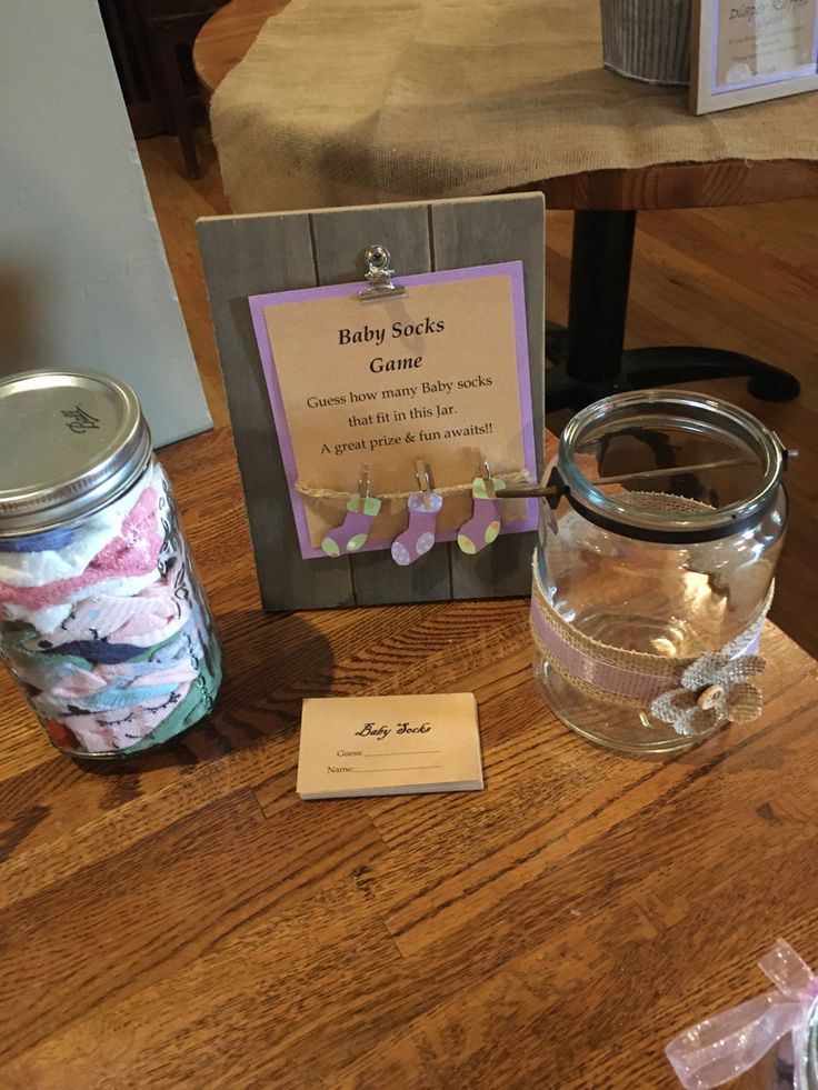 there is a glass jar with candy in it and a card on the table next to it