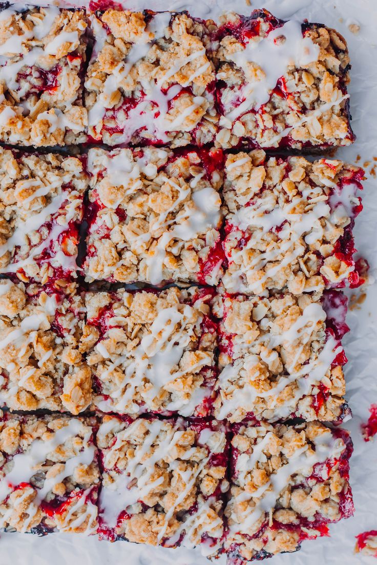 strawberry crumble bars with white icing on top