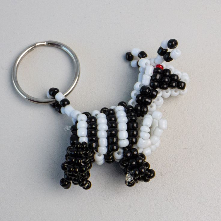 Beaded Animal Keychains - handmade by Kenyan market artisans for a Fair Trade boutique Beaded Animal Keychain Tutorial, Beaded Animal Keychains, Animal Keychain, Crayon Holder, Children's Mask, Animated Animals, Bag Charms, Safari Baby, Family Album