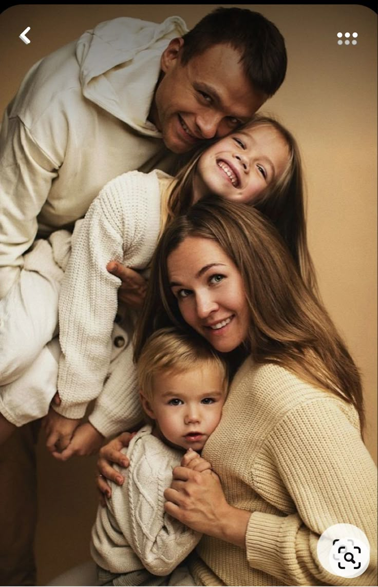 the family is posing for a photo together