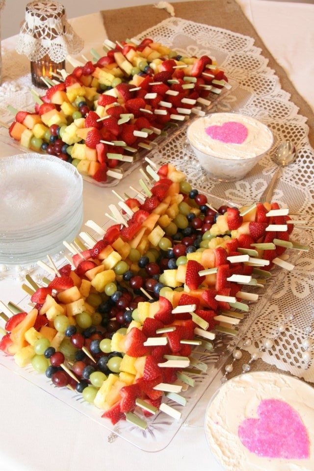 fruit skewers sitting on top of a table