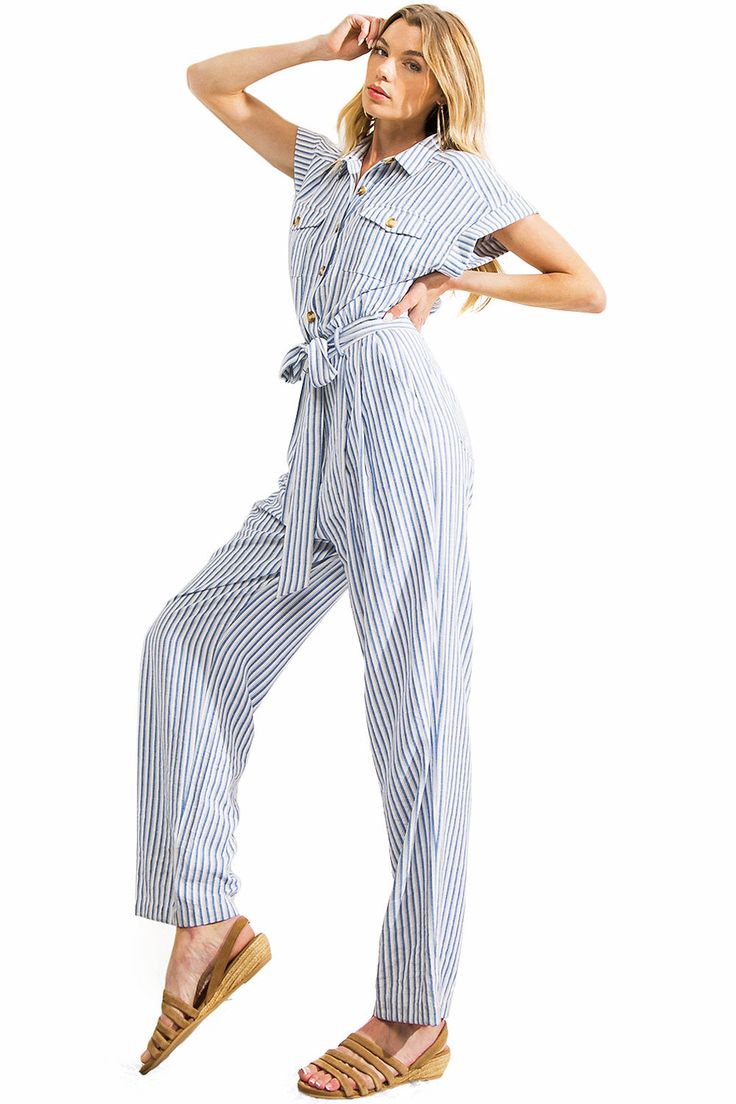 Nautical jumpsuit with a structured, collared neckline, button down closure and cuffed short- sleeves. Complete with patch pockets on the chest, slant pockets on the sides and back and a sash belt around the waist. Straight-leg silhouette for a polished look. CARE | Hand Wash Cold CONTENTS | 60% Rayon, 40% Polyester MEASUREMENTS | 58"/147 cm Top to Bottom 28"/71 cm Inseam (Size Small) MODEL | 5'8 - wearing a size Small IMPORTED Short Sleeve Denim Jumpsuit For Work, Casual Collared Belted Jumpsuits And Rompers, Casual Belted Collared Jumpsuits And Rompers, Belted Cotton Jumpsuits And Rompers With Short Sleeves, Belted Button-up Jumpsuits And Rompers For Spring, Summer Short Sleeve Denim Jumpsuit For Work, Spring Belted Button-up Jumpsuits And Rompers, Short Sleeve Belted Jumpsuits And Rompers For Work, Belted Short Sleeve Jumpsuits And Rompers For Work