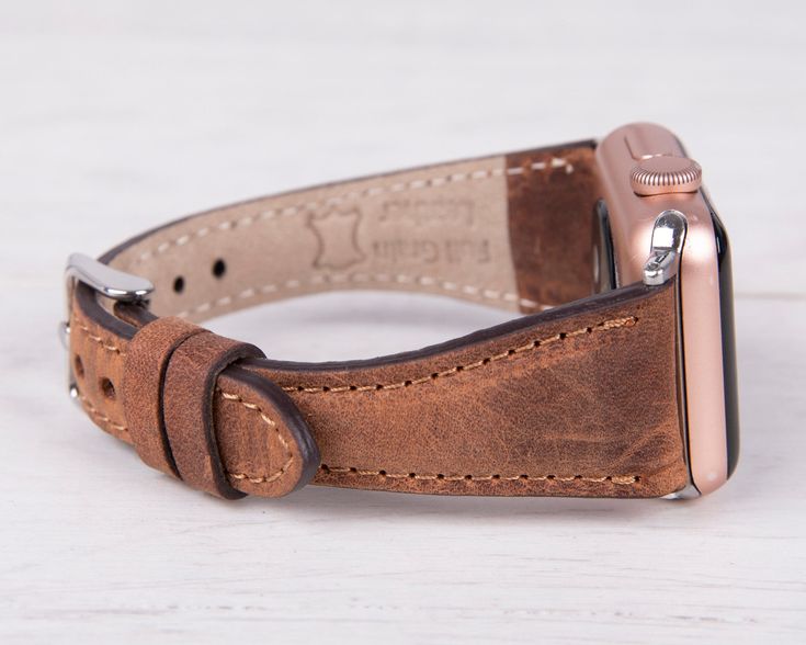 Embrace the art of handmade luxury with our antic brown leather slim Apple Watch band. Meticulously crafted from premium materials, this band offers a unique and stylish way to express your individuality. This luxurious accessory wraps twice around your wrist, adding a touch of elegance and effortless chic to your everyday style. Completely Handmade Genuine Full-Grain Leather Minimalist Slim Design Durable, Stylish & Timeless Design Stainless-Steel Buckles - Secure & Strong Compatible with all A Luxury Brown Adjustable Watch, Classic Brown Apple Watch Band For Everyday Use, Vintage Leather Bracelet Strap For Apple Watch, Leather Bracelet Strap Apple Watch Band As Gift, Vintage Leather Apple Watch Band With Bracelet Strap, Brown Leather Strap Apple Watch Band, Vintage Adjustable Apple Watch Band Rectangular, Vintage Adjustable Apple Watch Band, Brown Rectangular Wrist Strap For Watches