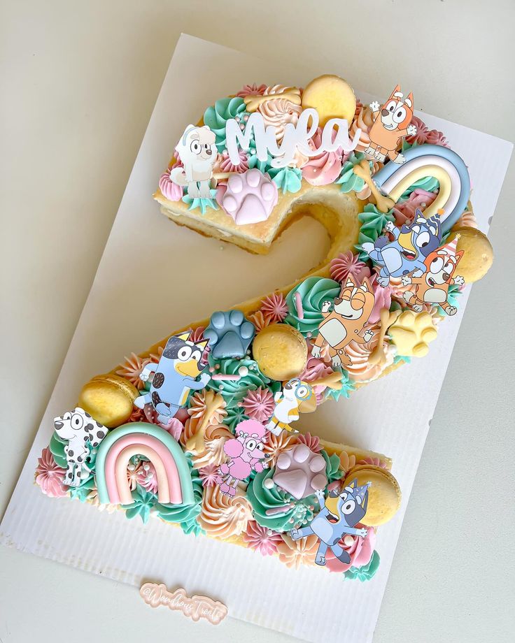 the number seven cake is decorated with colorful icing