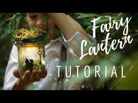 a girl holding a jar with plants in it and the words fairy lantern on top