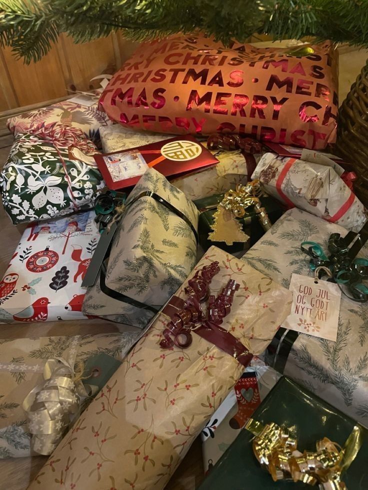 many wrapped presents under a christmas tree