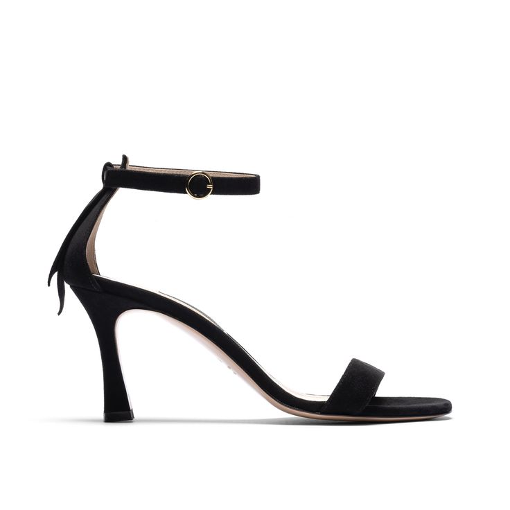 An elegant and minimal silhouette for when you want to feel a little flirty. We designed this 70mm heel to be extra stable so you can comfortably stand, walk, strut, and dance. Our Tacco features a stabilizing ankle strap with adjustable buckle, a covered back with tassel embellishment, and a padded insole to provide comfort to your feet. Made in soft black suede, the Tacco is a classic that you can wear for any occasion. This style is also available in Tan + Navy Suede and Rich Red Nappa. Sleek Kitten Heels With Heel Loop For Evening, Open Heel Kitten Heels With Sculpted Heel For Gala, Sleek Evening Kitten Heels With Heel Loop, Chic Heels With Sculpted Heel And Ankle Strap, Chic Ankle Strap Heels With Sculpted Heel, Sleek Ankle Strap Kitten Heels With Padded Heel, Sleek Kitten Heels With Ankle Strap And Padded Heel, Sleek Kitten Heels With Ankle Strap And Wrapped Heel, Sleek Kitten Heels With Wrapped Heel And Ankle Strap