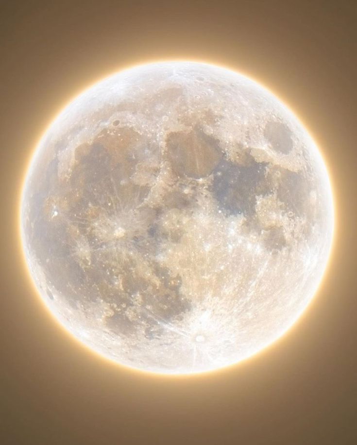 the sun is shining brightly in front of a full moon with no clouds on it