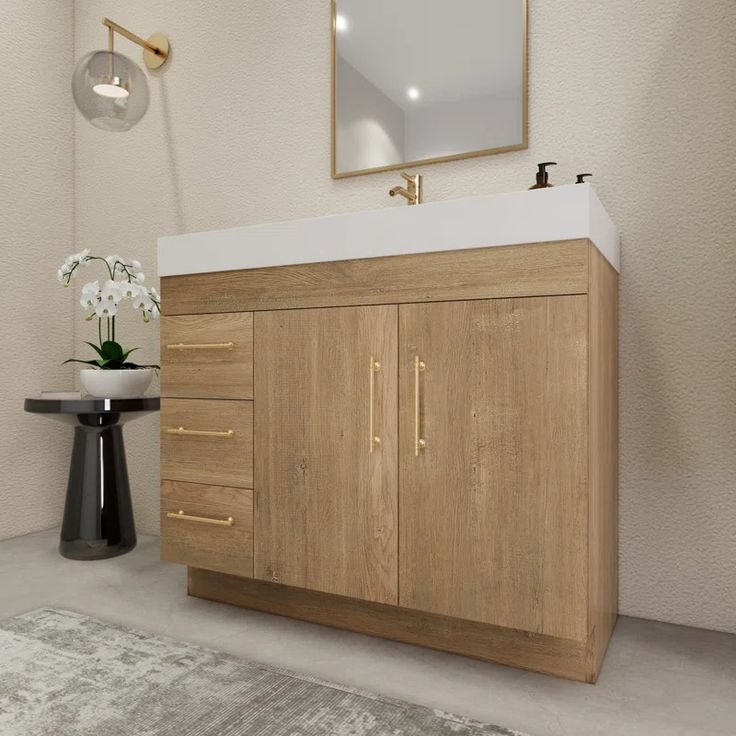 a bathroom with a sink, mirror and wooden cabinet