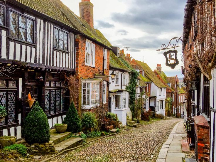 a cobblestone street lined with old buildings