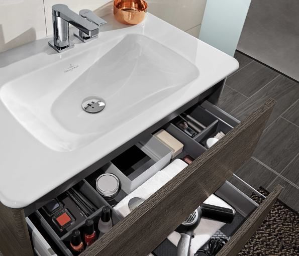 a bathroom sink with drawers underneath it