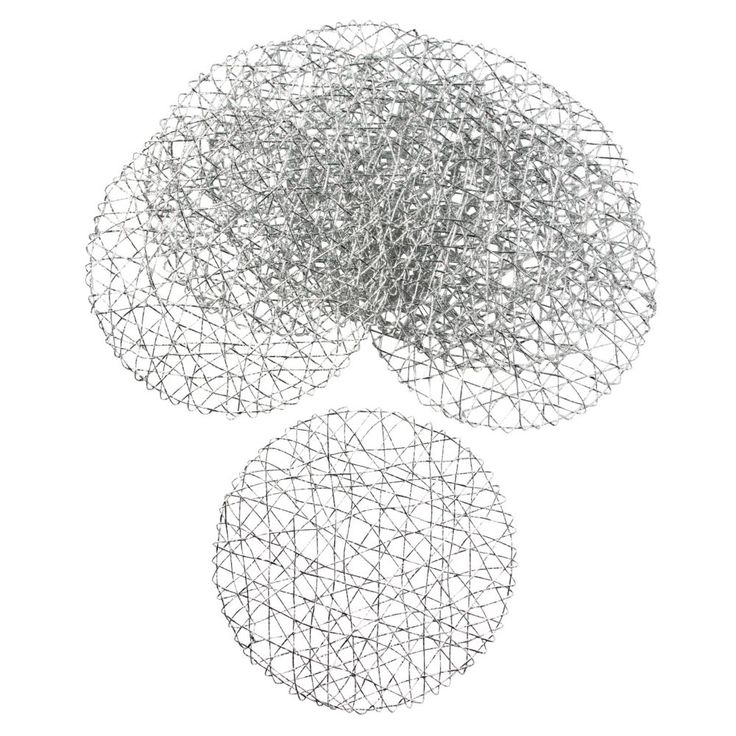 three circular pieces of wire sitting on top of each other in front of a white background