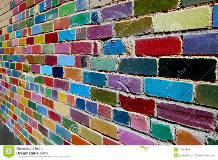 a colorful brick wall is painted in different colors