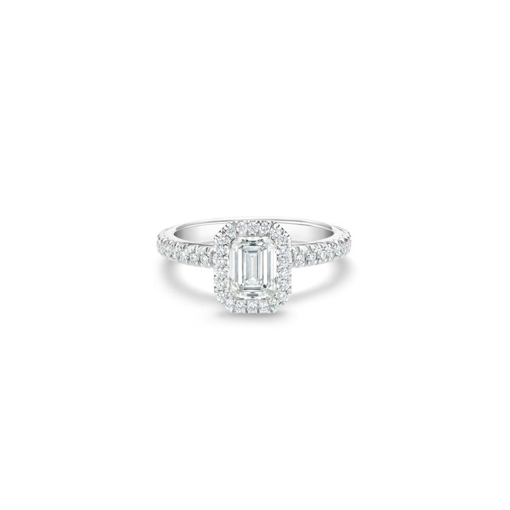 Radiant Cut Baguette Diamond Ring In Diamond White, Timeless Emerald Cut Diamond Ring With Center Stone, Classic Square Cut Halo Diamond Ring, White Emerald Cut Halo Wedding Ring, Emerald Cut Diamond Halo Ring With Center Stone, Diamond White Rings With Baguette Diamonds And Radiant Cut, White Emerald Cut Diamond Ring Timeless Style, White Gold Emerald Ring With Baguette Diamonds, Square Cut Baguette Diamond Ring