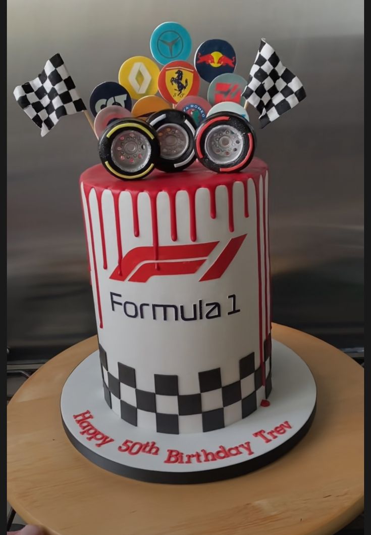 a birthday cake decorated with racing themed items