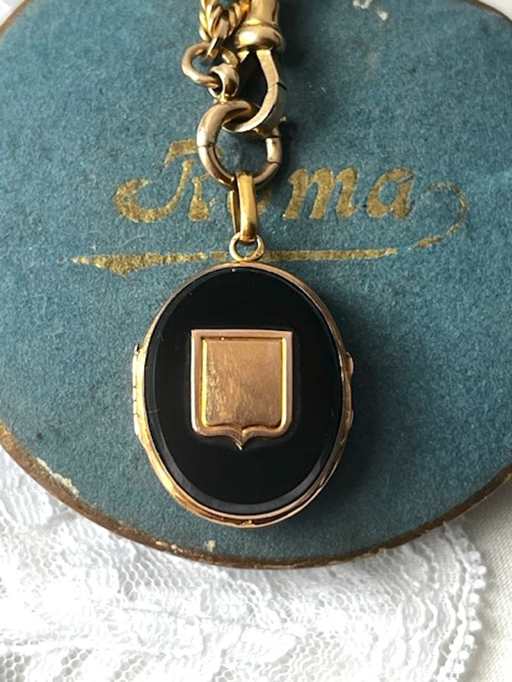 Antique French 18k Gold Onyx Locket with a shield. The locket is beautiful and in great condition. It has a glass inside and can hold a photo or a memento. It locks securely, it is hallmarked with a French eagle head on the bail ( for gold purity 18k gold). The shield symbolize protection and strength.  Weight: 8.25 grams Length: 1.5 inch Width: 0.7 inch  Excellent vintage conditions. Thank you for visiting Boudoir Vintage!   Please feel free to contact me for further information or photos.  I offer international shipping. Your item will be packed with extreme care and will be shipped within 3-5 working days. If you are dissatisfied with your item, please feel free to contact me and would be happy to assist.  If you are interested in paying in installments or reserve an item, please send m Classic Polished Locket Necklace For Formal Occasions, Classic Locket Necklace With Polished Finish For Formal Occasions, Classic Pendant Locket Necklace For Formal Occasions, Luxury Locket Necklace, Luxury Locket Necklace For Formal Occasions, Luxury Engraved Locket Necklace For Formal Events, Luxury Medallion Locket Necklace For Formal Occasions, Timeless Medallion Locket Necklace For Formal Occasions, Luxury Engraved Locket Necklace For Formal Occasions