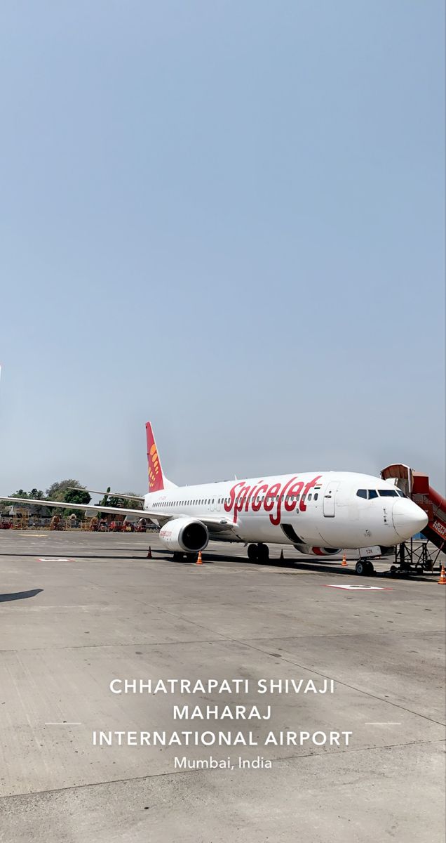 an airplane sitting on the tarmac at an airport