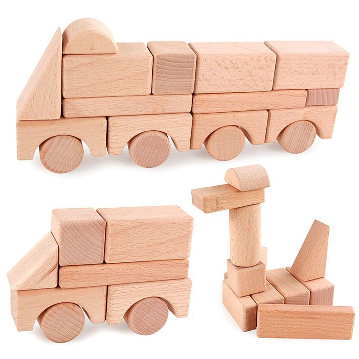 wooden toy truck and blocks on white background